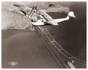 Pan Am Clipper flying over the Golden Gate Bridge